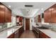 Modern kitchen featuring sleek countertops, wood cabinets, and stainless steel appliances at 8306 E Via De Dorado --, Scottsdale, AZ 85258