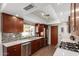 Modern kitchen featuring sleek countertops, wood cabinets, and stainless steel appliances at 8306 E Via De Dorado --, Scottsdale, AZ 85258