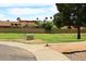 Serene neighborhood park featuring manicured lawns, lush greenery, and mature trees at 8306 E Via De Dorado --, Scottsdale, AZ 85258