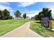 A walking path leads through a verdant park with mature trees and landscaping at 8306 E Via De Dorado --, Scottsdale, AZ 85258
