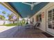 Charming covered patio with terracotta tiles, seating area, and access to a well-maintained backyard at 8306 E Via De Dorado --, Scottsdale, AZ 85258