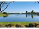 Beautiful pond with trees reflecting off of calm water and views of a golf course creating a peaceful and inviting scene at 8306 E Via De Dorado --, Scottsdale, AZ 85258