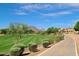 Scenic walking path beside a golf course with mountain views, showcasing a community focused on outdoor activities and recreation at 8306 E Via De Dorado --, Scottsdale, AZ 85258