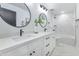 Modern bathroom with dual sinks, white marble counters, and elegant fixtures at 8316 E Glenrosa Ave, Scottsdale, AZ 85251