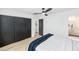 Bedroom with modern ceiling fan, large closet, and ensuite bathroom at 8316 E Glenrosa Ave, Scottsdale, AZ 85251