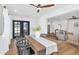 Bright dining room with French doors, modern lighting, and a seamless flow to the living area at 8316 E Glenrosa Ave, Scottsdale, AZ 85251