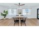 Bright dining room with modern lighting, dining table, and backyard views at 8316 E Glenrosa Ave, Scottsdale, AZ 85251