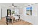 Bright dining room with modern lighting, dining table, and backyard views at 8316 E Glenrosa Ave, Scottsdale, AZ 85251