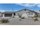 Charming single-story home with a desert landscaping, and a modern garage door at 8316 E Glenrosa Ave, Scottsdale, AZ 85251
