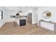 Modern kitchen with stainless appliances, seating, and hardwood floors at 8316 E Glenrosa Ave, Scottsdale, AZ 85251