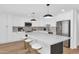 Modern kitchen featuring sleek countertops, stainless steel appliances, and stylish pendant lighting at 8316 E Glenrosa Ave, Scottsdale, AZ 85251