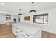 Bright, updated kitchen with large island, stainless appliances, and hardwood floors at 8316 E Glenrosa Ave, Scottsdale, AZ 85251