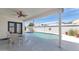 Relaxing covered patio overlooking a sparkling pool and well-maintained backyard at 8316 E Glenrosa Ave, Scottsdale, AZ 85251