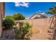 Landscaped backyard features gravel and partial grass in a desert environment at 8648 W Fargo Dr, Peoria, AZ 85382
