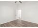 Neutral bedroom features wood-look floors and white walls and trim at 8648 W Fargo Dr, Peoria, AZ 85382