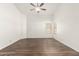 Bedroom with wood-look floors, vaulted ceiling, and lots of natural light from windows at 8648 W Fargo Dr, Peoria, AZ 85382