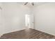 Bright bedroom features wood-look floors, ceiling fan, and neutral paint at 8648 W Fargo Dr, Peoria, AZ 85382