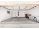 Spacious garage with painted walls, storage, and concrete floors at 8648 W Fargo Dr, Peoria, AZ 85382