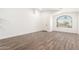 Open living space with modern flooring, large windows, and a welcoming entryway at 8648 W Fargo Dr, Peoria, AZ 85382