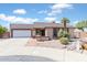 Charming single-story home with well-maintained landscaping and a two-car garage at 905 E Bluefield Ave, Phoenix, AZ 85022