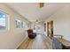 Bright sunroom with new floors, ceiling fan, and lots of natural light at 905 E Bluefield Ave, Phoenix, AZ 85022