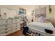 Personalized bedroom with white furniture, desk, and lots of decorations for a unique living space at 1011 E Amberwood Dr, Phoenix, AZ 85048