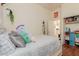 Cozy bedroom with hardwood floors, a closet with organizers and decor at 1011 E Amberwood Dr, Phoenix, AZ 85048