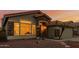 Close up of the single-Gathering home with a terracotta roof, desert landscaping, and stone accents at 1011 E Amberwood Dr, Phoenix, AZ 85048
