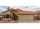 Close up of the single-Gathering home with a terracotta roof, desert landscaping, and stone accents at 1011 E Amberwood Dr, Phoenix, AZ 85048