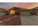 Charming single-Gathering home with a terracotta roof, desert landscaping, and stone accents at 1011 E Amberwood Dr, Phoenix, AZ 85048