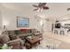 Inviting living room open to the kitchen, featuring a large sectional sofa at 1011 E Amberwood Dr, Phoenix, AZ 85048