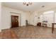 Spacious living room featuring neutral walls, tile flooring, and ample natural light at 1011 E Amberwood Dr, Phoenix, AZ 85048