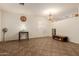 Bright living room with tile floors, chandelier, and ample space at 1011 E Amberwood Dr, Phoenix, AZ 85048