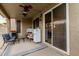 Inviting patio with a ceiling fan, sliding door access, and a comfortable seating area perfect for outdoor relaxation at 1011 E Amberwood Dr, Phoenix, AZ 85048