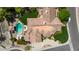 Aerial shot of a stunning home showcasing a backyard oasis with a sparkling pool at 10205 E Corrine Dr, Scottsdale, AZ 85260