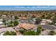 Desert community home with a swimming pool and mature trees in a residential area at 10205 E Corrine Dr, Scottsdale, AZ 85260