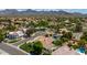 Scenic aerial view of a desert community with beautiful homes and mountain views at 10205 E Corrine Dr, Scottsdale, AZ 85260