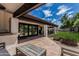 Expansive backyard with a covered patio, outdoor kitchen, and a playground in the yard at 10205 E Corrine Dr, Scottsdale, AZ 85260