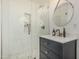 Modern bathroom featuring tiled shower, and sleek vanity with stylish fixtures at 10205 E Corrine Dr, Scottsdale, AZ 85260