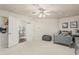Large bedroom with french doors, a comfortable bed, and soft carpeting for a cozy feel at 10205 E Corrine Dr, Scottsdale, AZ 85260