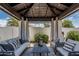 Comfortable cabana with seating, offering a relaxing outdoor retreat at 10205 E Corrine Dr, Scottsdale, AZ 85260