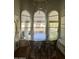 Bright dining room with vaulted ceiling, large windows, and stylish lighting at 10205 E Corrine Dr, Scottsdale, AZ 85260