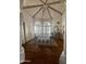 Elegant dining room with vaulted ceiling, hardwood floors, and plantation shutters at 10205 E Corrine Dr, Scottsdale, AZ 85260