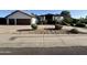 Charming single-Gathering home featuring a tile roof, desert landscaping, and a spacious driveway at 10205 E Corrine Dr, Scottsdale, AZ 85260