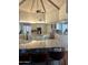 Spacious kitchen featuring a center island, custom cabinetry, and granite countertops at 10205 E Corrine Dr, Scottsdale, AZ 85260