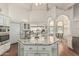 Well-equipped kitchen with granite countertops, stainless steel appliances, island, and ample cabinet space at 10205 E Corrine Dr, Scottsdale, AZ 85260