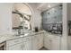 Well-designed kitchenette featuring granite countertops, modern appliances, and stylish backsplash at 10205 E Corrine Dr, Scottsdale, AZ 85260