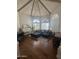 Spacious living room with hardwood floors, vaulted ceiling, and natural light at 10205 E Corrine Dr, Scottsdale, AZ 85260