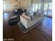 Elegant living room with hardwood floors, neutral decor, and patio access at 10205 E Corrine Dr, Scottsdale, AZ 85260
