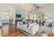 Spacious living room boasts hardwood floors, fireplace, comfortable seating, and abundant natural light at 10205 E Corrine Dr, Scottsdale, AZ 85260